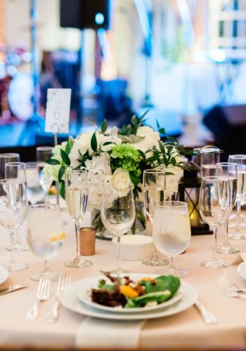 Table with Plated Salads and Napkins and Wine Glasses, Wedding Reception