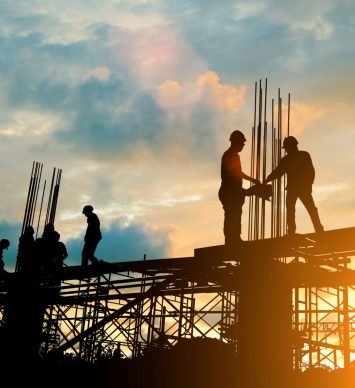 Silhouette of engineer and construction team working at site over blurred background sunset pastel for industry background with Light fair.Create from multiple reference images together.